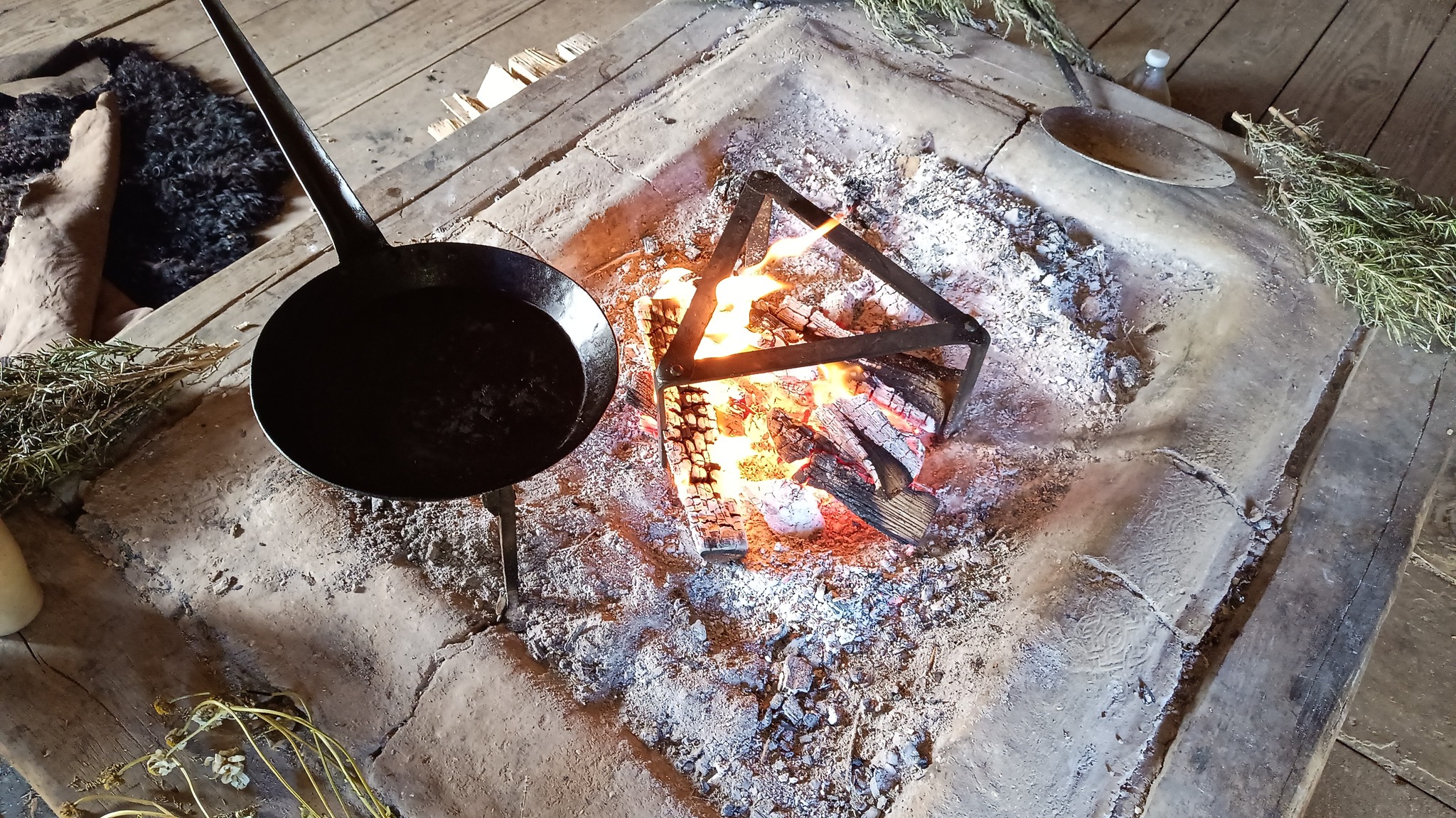 An open fire with skillet pan